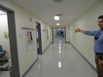 An updated hallway in the school is shown by VP Colden Golann. (photo by Erica Thoms)
