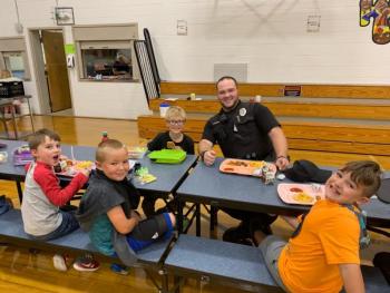 Thomaston Police Officer, Jake Grinnell, joins students for lunch on the first day of school.