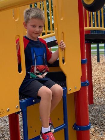 Malcolm Brown enjoys playing on the playground.
