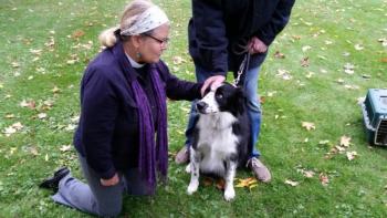 Rev. Abby Pettee, Chaplain at Pen Bay Medical Center, blesses “Teddy” at the annual Service of Blessing the Animals held Oct. 6 on Camden’s Village Green. (Photo by Sarah Shepherd)