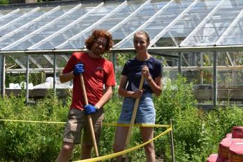 Davis Saltonstall and Tessa Rosenberry break ground on their new composting venture. (Photo by Sarah Thompson)