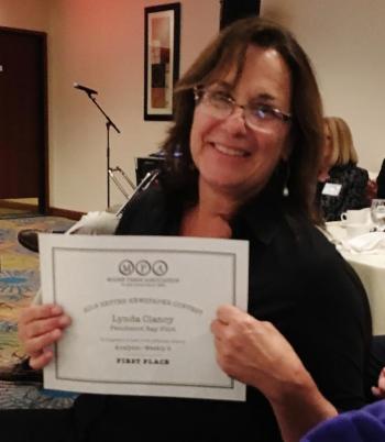 Pen Bay Pilot editorial director Lynda Clancy holds the certificate for her first place Analysis article. KEVIN BURNHAM/Boothbay Register