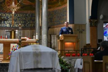 Admiral Karl Shultz, Commandant, U.S. Coast Guard, speaks at the end of the funeral Mass. (U.S. Coast Guard Photo by Petty Officer 3rd Class Brian McCrum)