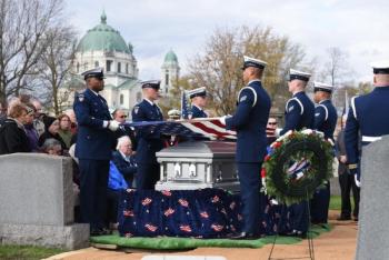 Ceremonial Honor Guard begins the flag-folding ceremony as part of the full military honors burial. (U.S. Coast Guard photo by Petty Officer 3rd Class Brian McCrum)
