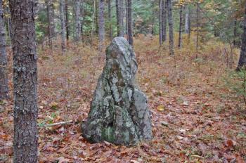 A 4-foot-tall standing stone with traces of red staining is located in a flat area next to the Ducktrap River. (Photo courtesy Dennis Cerrotti)