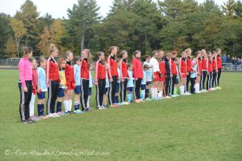 Camden Hills girls soccer players on the field prior to a varsity game with area youth players. (File Photo/Ron Hawkes)