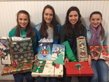 Lauren Rothwell, Alli Wells, Mallory Caron and Grace Iltis, in 2016. As part of the CHRHS ‘Camden for Community’ club, they adopted their own family at the Hospitality House for the holidays. (Photo by Mallory Caron)