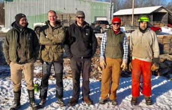 (L to R) Avery Smith, Galen Lichterfeld, Travis Hamilton, Jason Robeson and Tery Bradshaw, all put in six hours of volunteer time on Dec. 9 to help process wood for Waldo county families. (Photo courtesy Bob MacGregor)