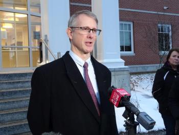 Defense attorney Chris MacLean speaks to reporters.
(photo by Erica Thoms)