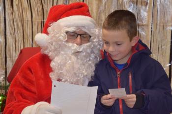 Noah Blakey reads his Christmas letter to Santa. (Photo courtesy Thomaston Grammar School)
