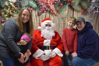 The Fish Family (Jenny, Evelyn, Preston, and Keith) visit Santa. (Photo courtesy Thomaston Grammar School)