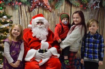 Hazel, Azrael, Bailee, and Ryker Dare visit with Santa. (Photo courtesy Thomaston Grammar School)