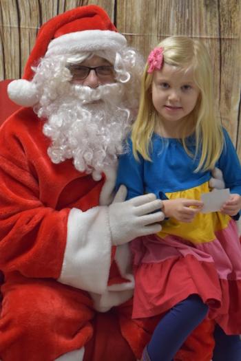 Ella Chamberlin tells Santa what she would like for Christmas. (Photo courtesy Thomaston Grammar School)