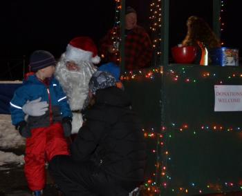 Santa was at the harbor, visiting with children before the final push at the North Pole this coming week. (Photo by Lynda Clancy)