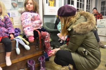 Warming up the toes inside the Rockport Harbor Master’s office. (Photo by Lynda Clancy)