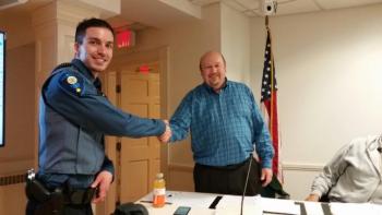 Rockport Town Manager Bill Post congratulates Officer Jonathan Poole after his pinning ceremony. (Photo by Sarah Shepherd)