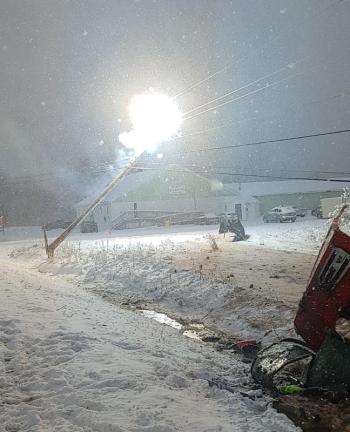 A fireball explodes from one of the broken CMP poles as police look on from a safe distance.
(photo courtesy of Belfast Police Sergeant Detective Matt Cook)