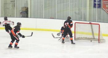 The Camden Hills varsity ice hockey team in its Jan. 4 game against Brunswick. (Courtesy Molly Cole)