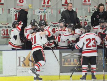The Camden Hills ice hockey team in a Jan. 11 game. (Courtesy Molly Cole)