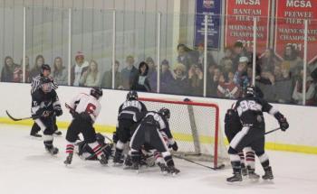 The Camden Hills ice hockey team in a Jan. 11 game. (Courtesy Molly Cole)