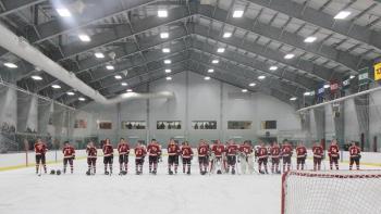 The Camden Hills varsity ice hockey team in a Jan. 14 game. (Courtesy Molly Cole)