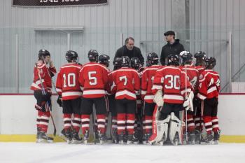 The Camden Hills varsity ice hockey team in a Jan. 14 game. (Courtesy Molly Cole)