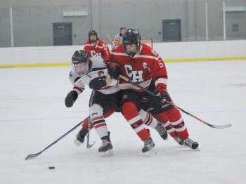 The Camden Hills varsity ice hockey team in a Jan. 14 game. (Courtesy Molly Cole)