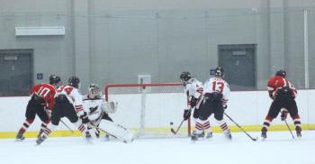 The Camden Hills varsity ice hockey team in a Jan. 14 game. (Courtesy Molly Cole)