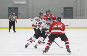The Camden Hills varsity ice hockey team in a Jan. 14 game. (Courtesy Molly Cole)