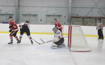 The Camden Hills varsity ice hockey team in a Jan. 14 game. (Courtesy Molly Cole)
