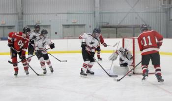 The Camden Hills varsity ice hockey team in a Jan. 14 game. (Courtesy Molly Cole)
