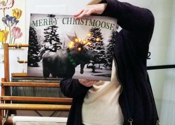 Howard Green displays the Christmas plaque he fixed. Photo courtesy Bart Read.