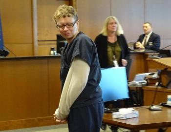 Sharon Kennedy (formerly Carrillo) looks back at her family as she is escorted out of the courtroom. (photo by Erica Thoms)