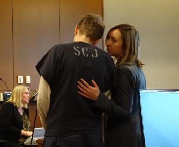 Attorney Laura Shaw comforts Sharon during her sentencing. (photo by Erica Thoms)