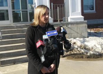 Laura Shaw speaks with reporters following the hearing. (photo by Erica Thoms)