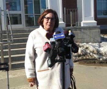 Assistant Attorney General Leane Zainea speaks with reporters following the hearing. (photo by Erica Thoms)