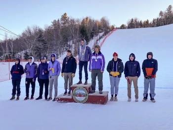 Camden Hills skiers Oscar Horovitz (far left) and Devon Smith (far right) at the podium Feb. 8. (Courtesy Mike Smith)