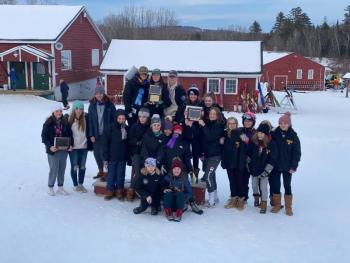 On center podium, in back, are Camden Snow Bowl skiers Greer Lafiura, Zola Roberts and Lily Stowe. Next row includes Ula Durow, Grace Decubellis, Piper Urey, Maggie Metzler, Katie Grace. Front row includes Estelle Chase and Olive Walker. (Courtesy Weber Roberts)