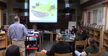 Belfast Area High School teacher Chip Lagerbom, standing, gives a presentation at the Jan. 13 RSU 71 school board meeting on the underwater robot (pictured) that will be purchased.
