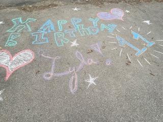 The neighbors even decorated the driveway with balloons and chalk art for her special day. (Photo courtesy Christina Tibbetts)