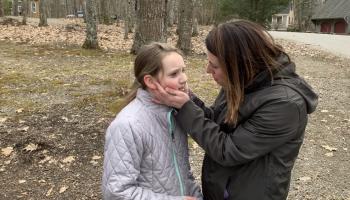 Christina Tibbetts talks to her daughter, Lyla, who turned 11 on April 1. Pictured here: Lyla can’t believe it as a parade drives by her house for her birthday. (Photo courtesy Christina Tibbetts)