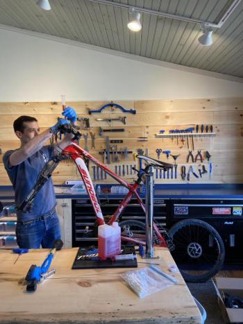 Working on a bike. Photo courtesy Chris Gardner