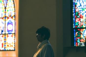 The Rev. Carolyn H. Eklund of St. Paul’s Episcopal Church is photographed in Brunswick on Sunday, May 3. Eklund has been administering the last rites remotely via Zoom due to COVID-19. (Photo by Yoon S. Byun)