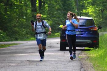 Abigail Nathan, right, and her father Jeff running a graduation day half-marathon. (Courtesy Ellen Curtis)