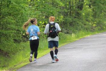 Abigail Nathan, left, and her father Jeff running a graduation day half-marathon. (Courtesy Ellen Curtis)
