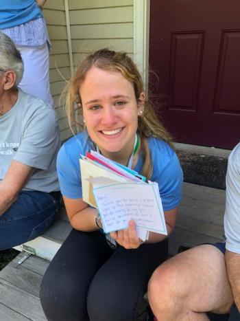 Abigail Nathan reading through the surprise letters from her teachers. (Courtesy Christine Nathan)