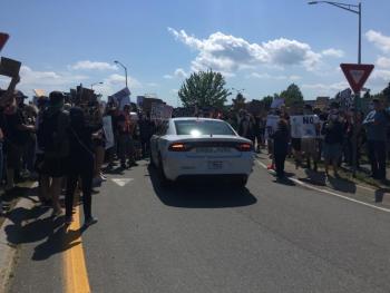 The border patrol’s attempt to drive through the crowd of protestors was met with a wall of humanity. (Photo courtesy Molly Mulhern)