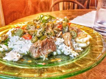 West African Gumbo: Beef, shrimp, chicken, smoked salmon, and crab meat blended with red, yellow, and green bell peppers, okra, onion, garlic, and spices. Photo courtesy Mé Lon Togo