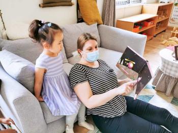 Carolyn Remley reads to a student. Courtesy photo