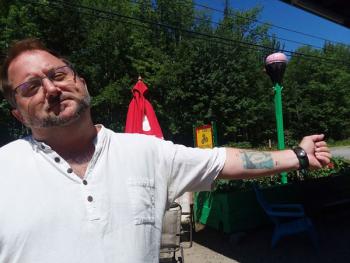 Kenny’s tattoo, “The Starry Night” was the influence for the mural on the garage next to the shack. Photo by Kay Stephens